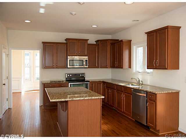 26 Miners Trail Road Midlothian, VA 23114 - Photo 10 of 24 a kitchen with stainless steel appliances granite countertop a sink stove microwave and refrigerator