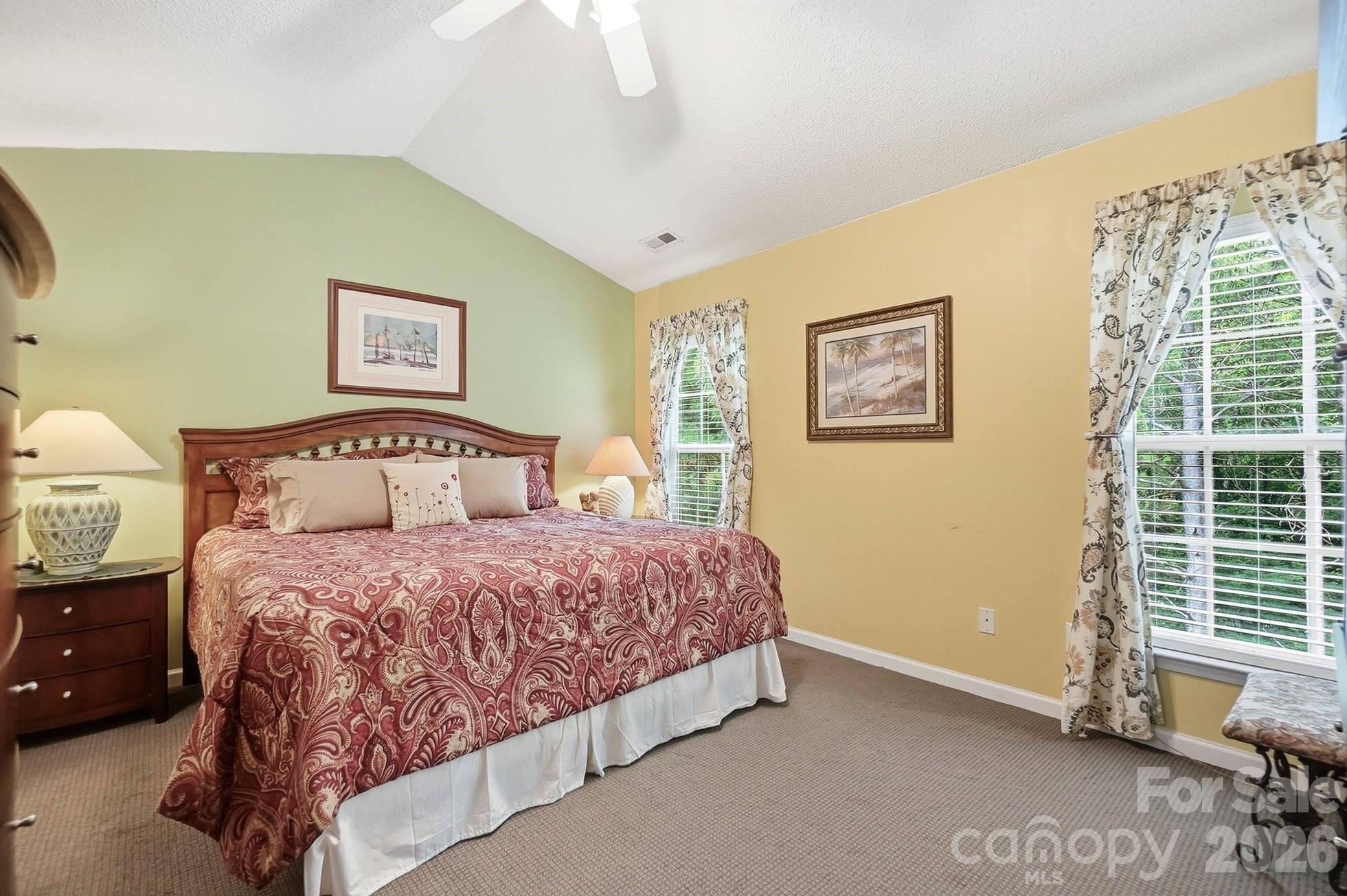 442 Sugar Maple Drive Tega Cay, SC 29708 - Photo 19 of 48 a bedroom with a bed and a window