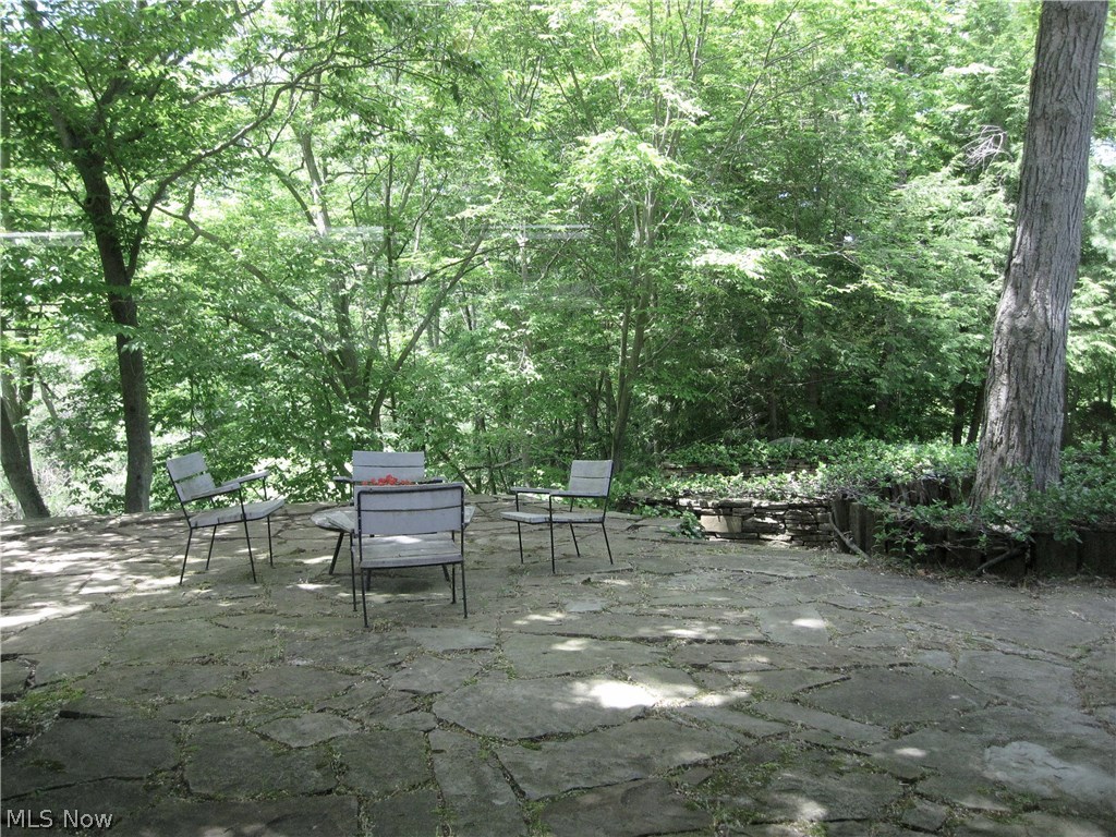 5 Pepper Ridge Road Cleveland, OH 44124 - Photo 22 of 33 Stone patio off the dining room with the lower level stone terrace below.
