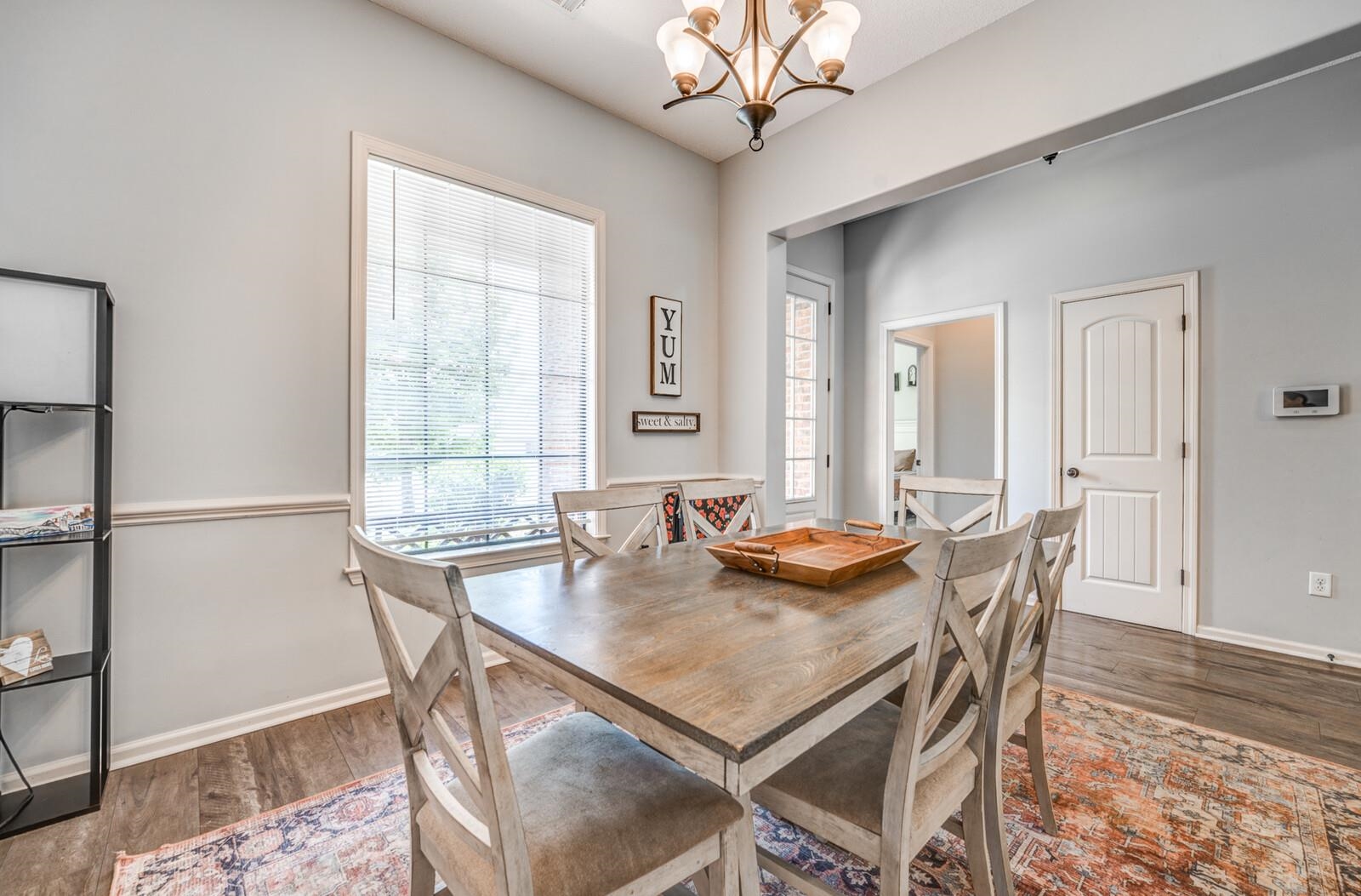 4671 Hampton Ridge Lane Bartlett, TN 38002 - Photo 11 of 40 Dining area featuring a vaulted ceiling and an ornate chandelier