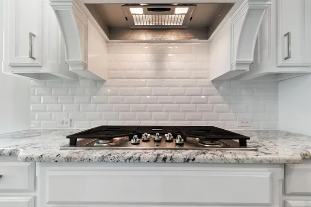 a close view of a stove a sink and dishwasher