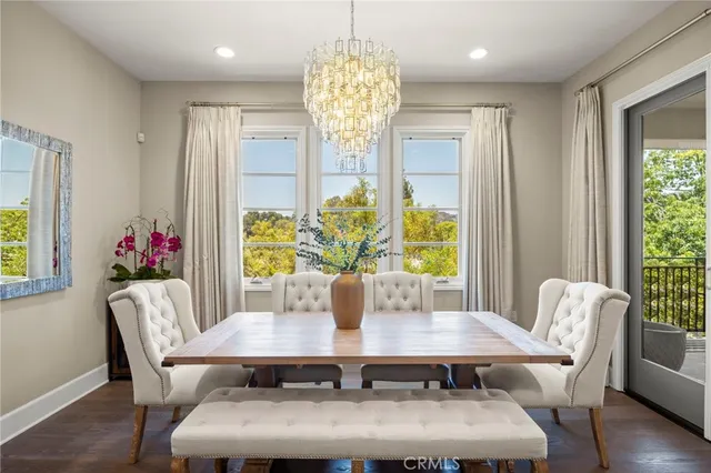 a view of a dining room with furniture and window