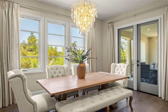 a view of a kitchen with wooden floor and a kitchen