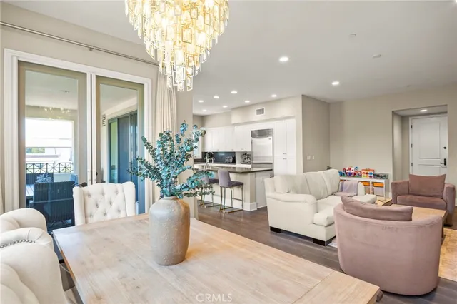 a view of a room with wooden floor and windows