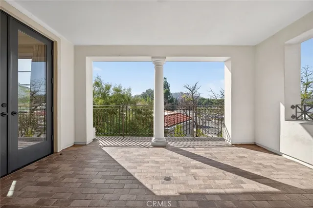 a view of a livingroom with wooden floor and a window