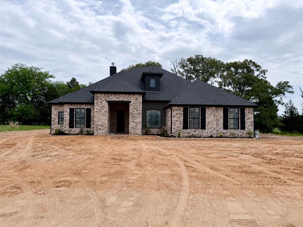 13836 Cedar Hl Lane Tyler, TX 75708 - Photo 1 of 1 a front view of a house with a yard and garage