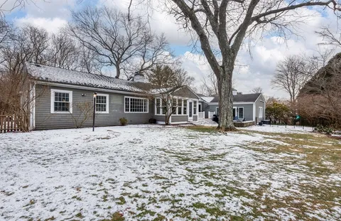 a house with trees in front of it