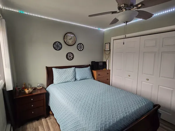 a bedroom with a bed and a table