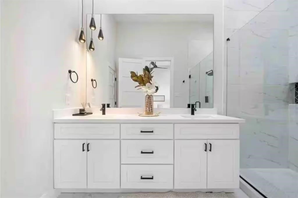 3610 Dreyfus Street, Unit A Houston, TX 77021 - Photo 13 of 20 a bathroom with white cabinets and sink