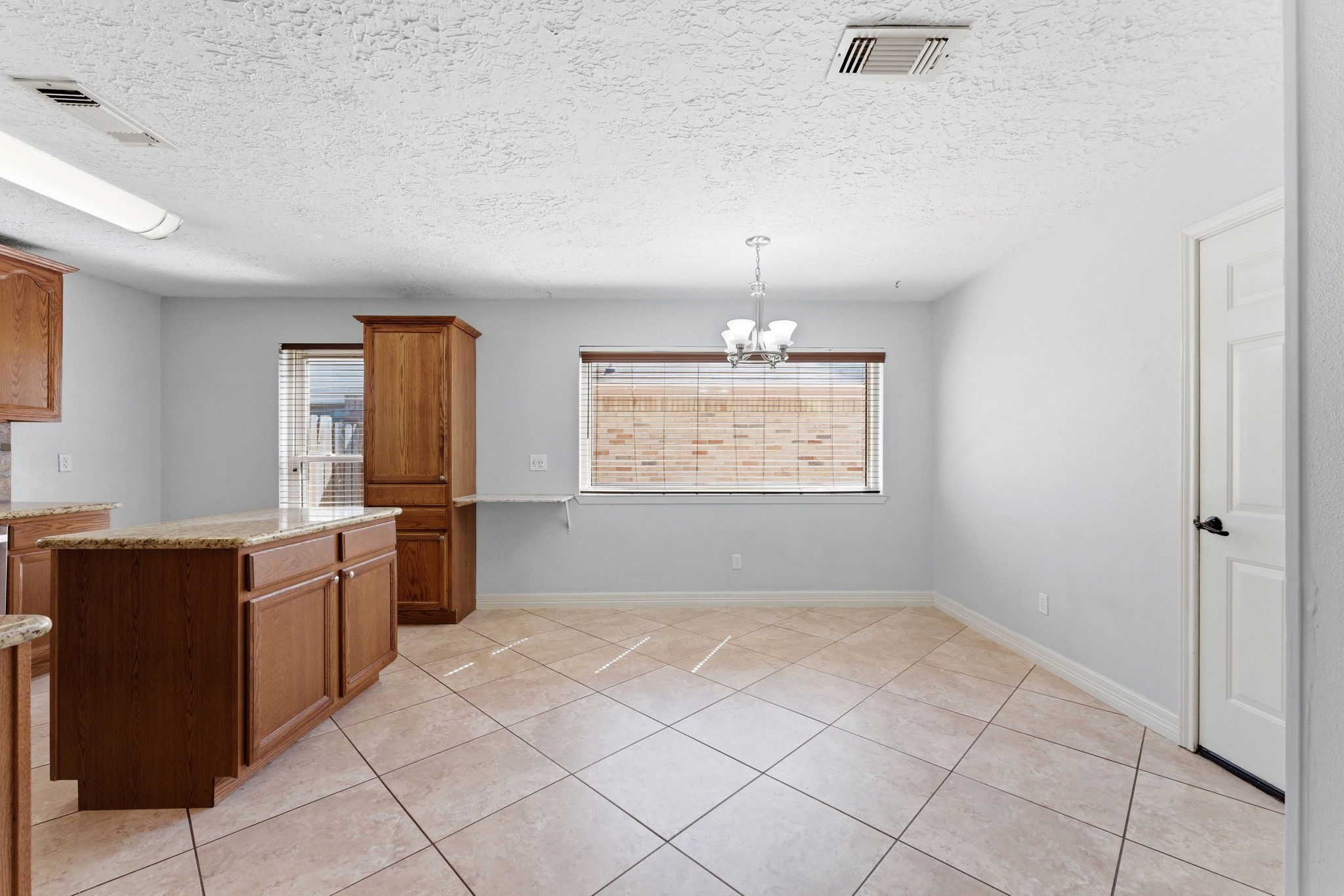 21514 Slippery Creek Lane Spring, TX 77388 - Photo 13 of 27 a spacious bathroom with a granite countertop sink a mirror and a bathtub