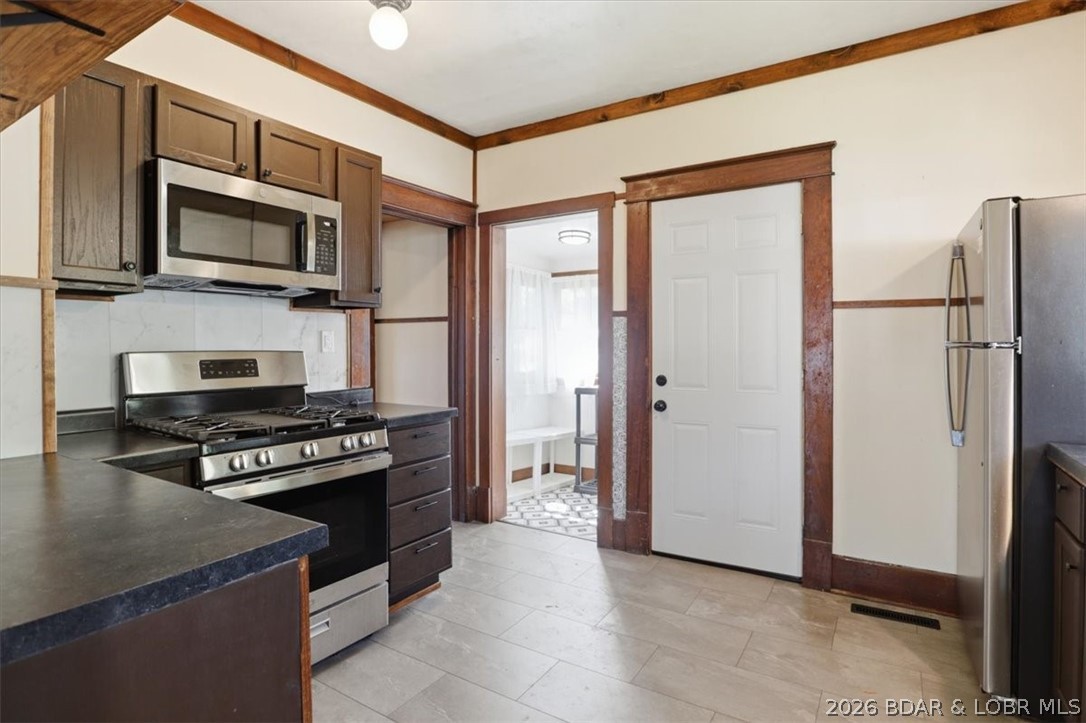 301 South Locust Street Eldon, MO 65026 - Photo 12 of 35 Updated kitchen with stainless steel appliances, n
