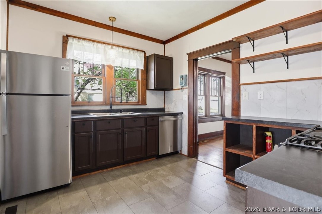 301 South Locust Street Eldon, MO 65026 - Photo 13 of 35 Open shelving in the kitchen in addition to cabine