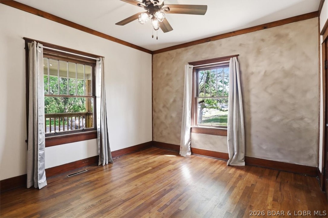 301 South Locust Street Eldon, MO 65026 - Photo 16 of 35 Bedroom one...large windows, original hardwoods an