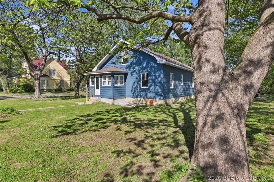 301 South Locust Street Eldon, MO 65026 - Photo 6 of 35 Mature trees offer plenty of shade
