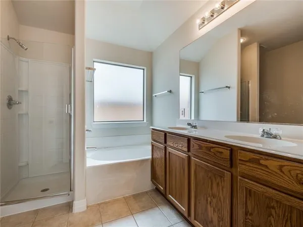 a bathroom with a bathtub and a sink