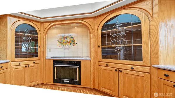 a view of a living room with a fireplace and a window