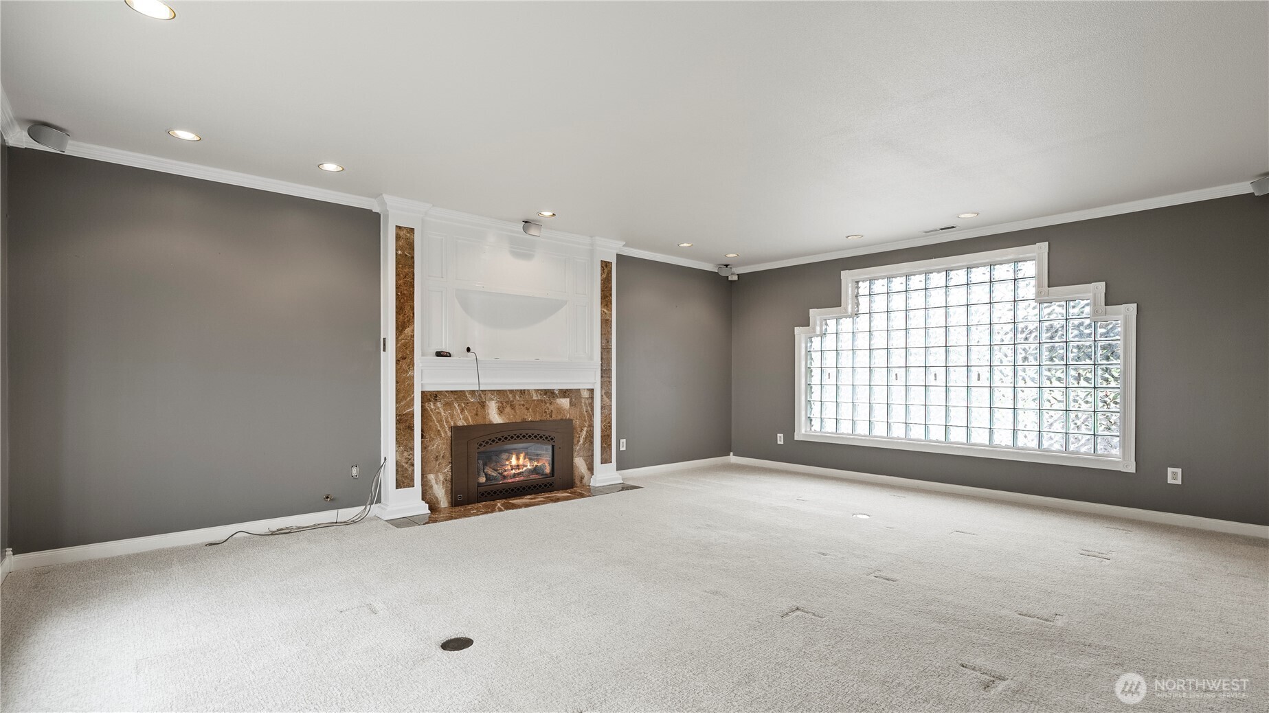 31 Rangeview Road Othello, WA 99344 - Photo 7 of 40 a view of an empty room with a fireplace and a window