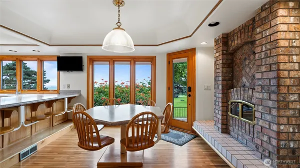 a view of a dining room with furniture window and wooden floor