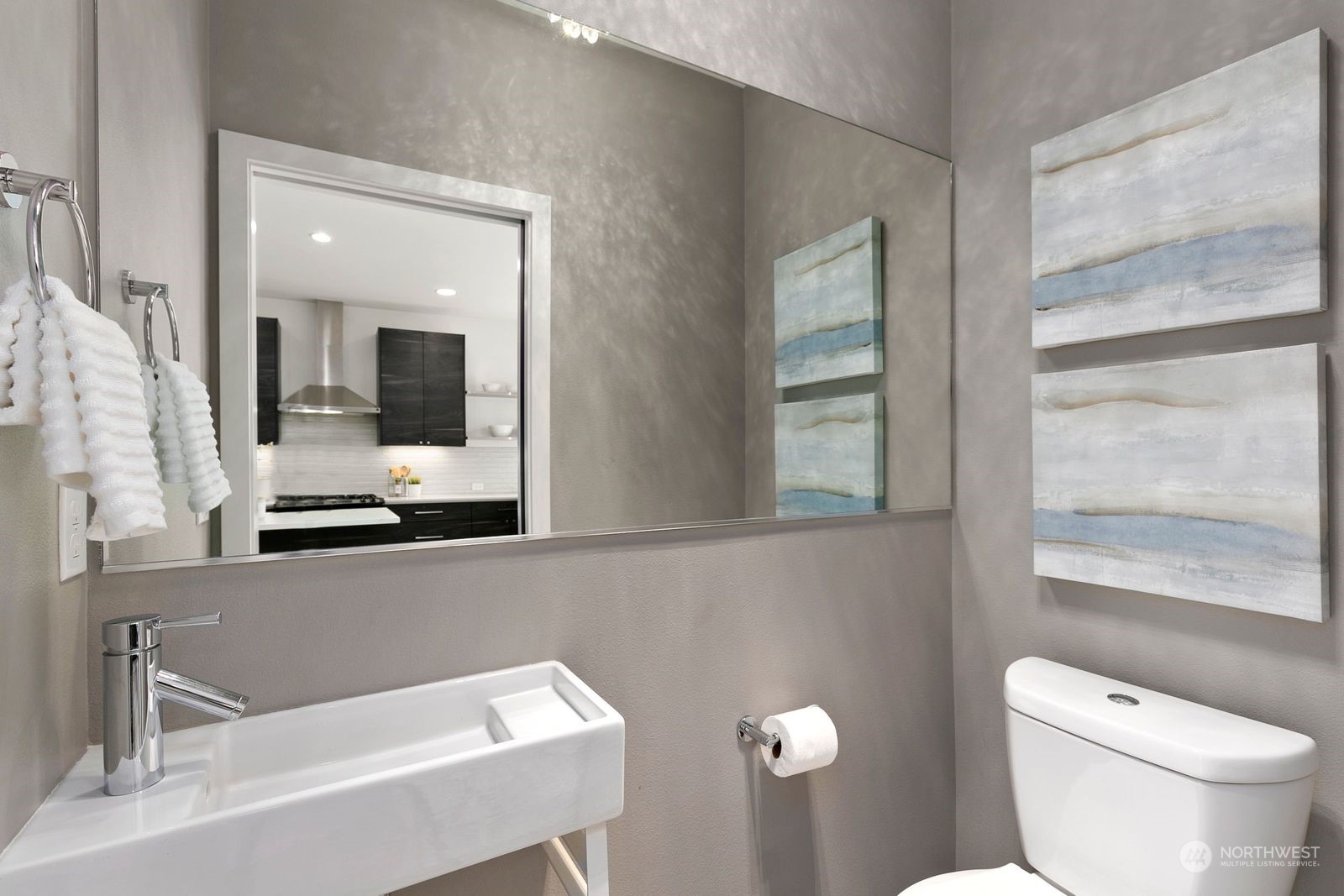 4252 Southwest Myrtle Street, Unit D Seattle, WA 98136 - Photo 20 of 22 a bathroom with a toilet a sink and a mirror