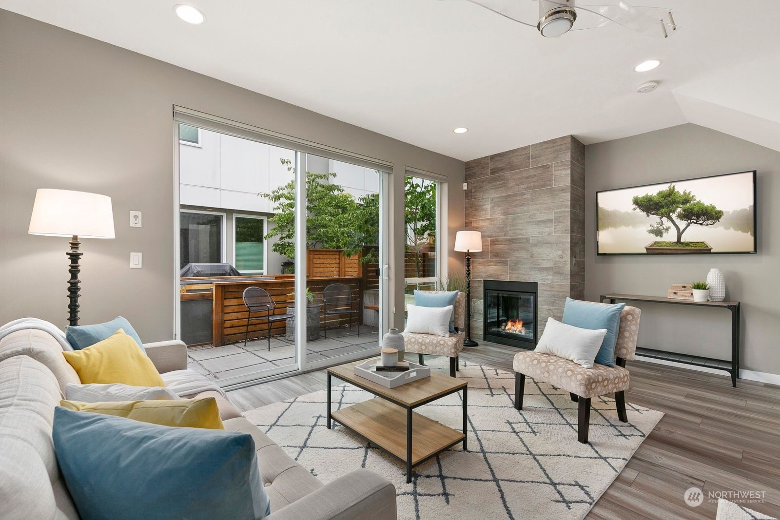 4252 Southwest Myrtle Street, Unit D Seattle, WA 98136 - Photo 3 of 22 a living room with furniture a fireplace and a table