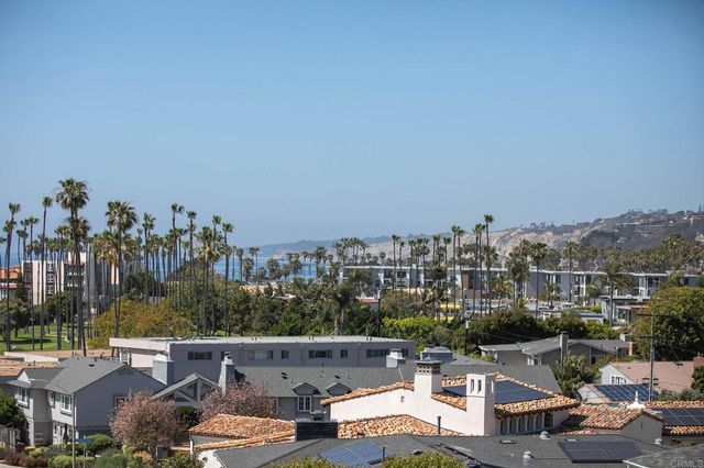 a bathroom with a double vanity sink mirror and toilet