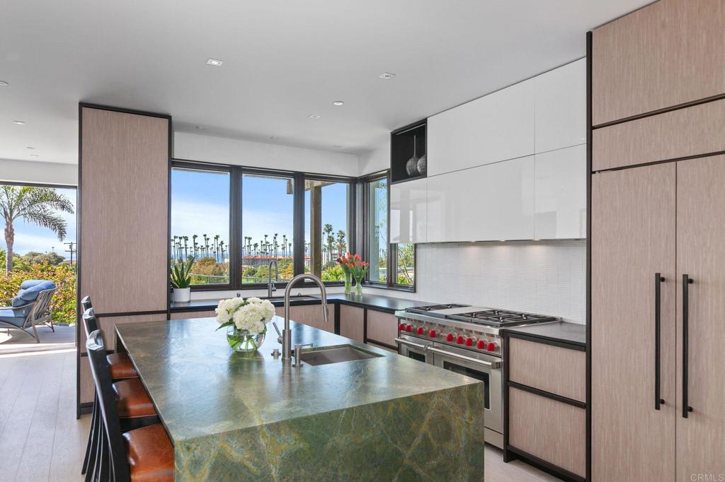 2045 Lowry Place La Jolla, CA 92037 - Photo 3 of 19 a dining room with furniture and a floor to ceiling window