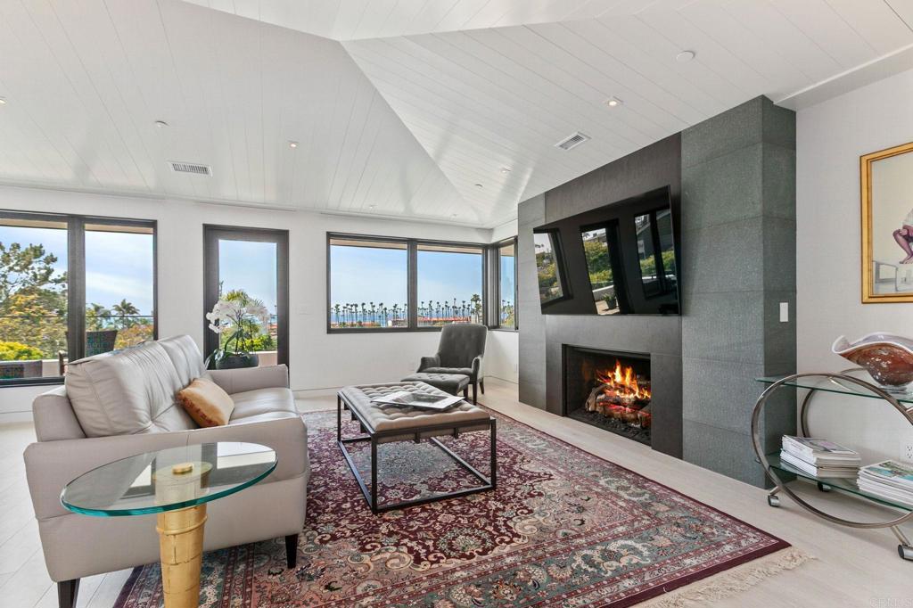 2045 Lowry Place La Jolla, CA 92037 - Photo 10 of 19 a living room with furniture and a fireplace