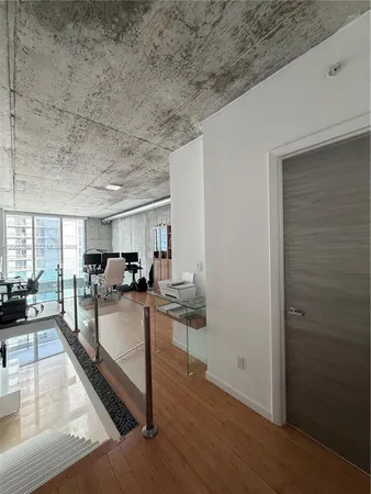 a bedroom with a large bed and a large window