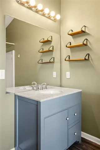 a bathroom with a sink and a mirror