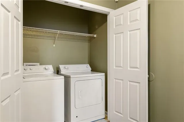 a balcony with wooden floor and fence
