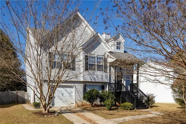 a front view of a house with garage