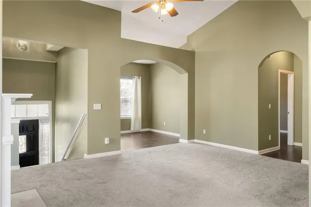 a view of a bathroom with a granite countertop sink and a mirror
