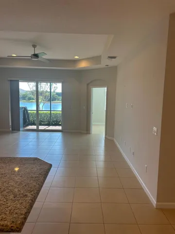 a kitchen with stainless steel appliances granite countertop a refrigerator stove and microwave