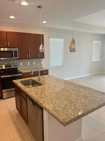 a view of a livingroom with an empty space and a fireplace