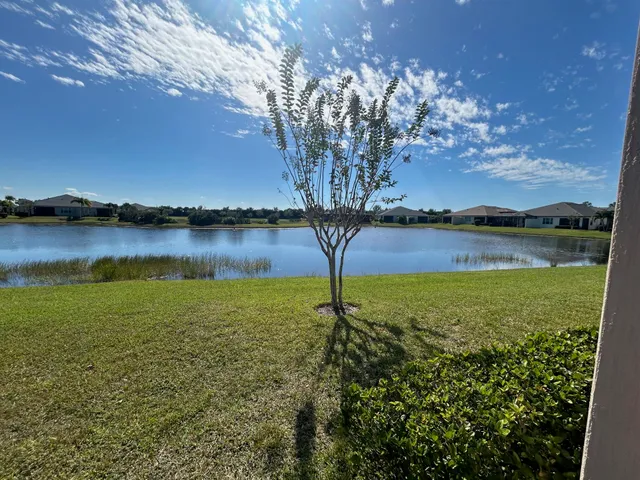 a view of a lake with houses in the back