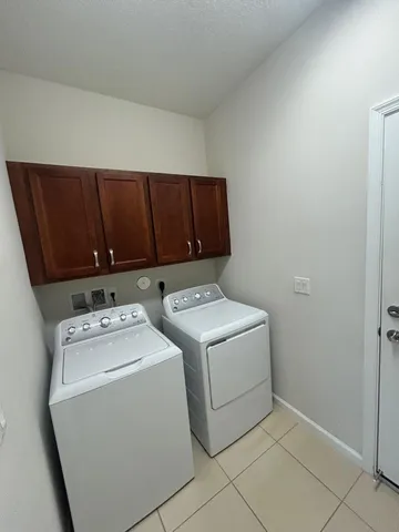 a bathroom with a granite countertop bathtub toilet and a shower