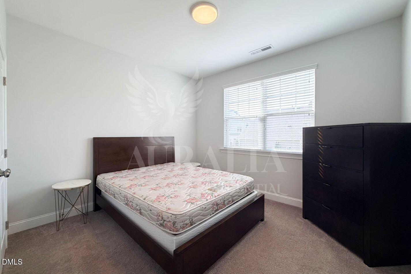 1306 Farm Pond Trail Durham, NC 27703 - Photo 16 of 46 a bedroom with a bed and window