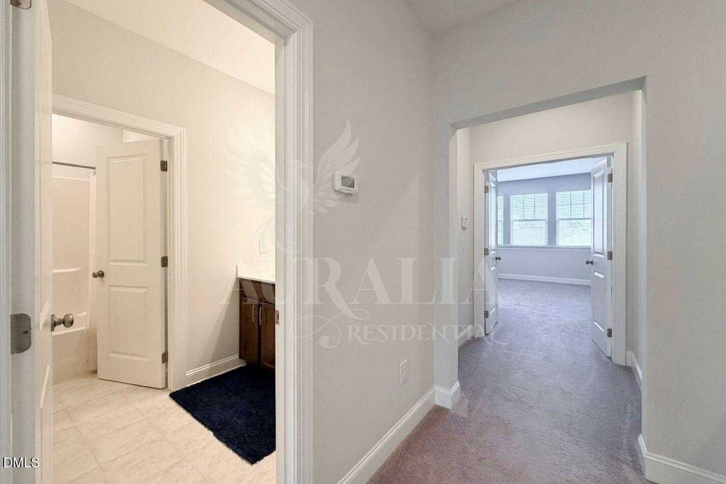 1306 Farm Pond Trail Durham, NC 27703 - Photo 20 of 46 a view of a hallway with wooden floor and closet area