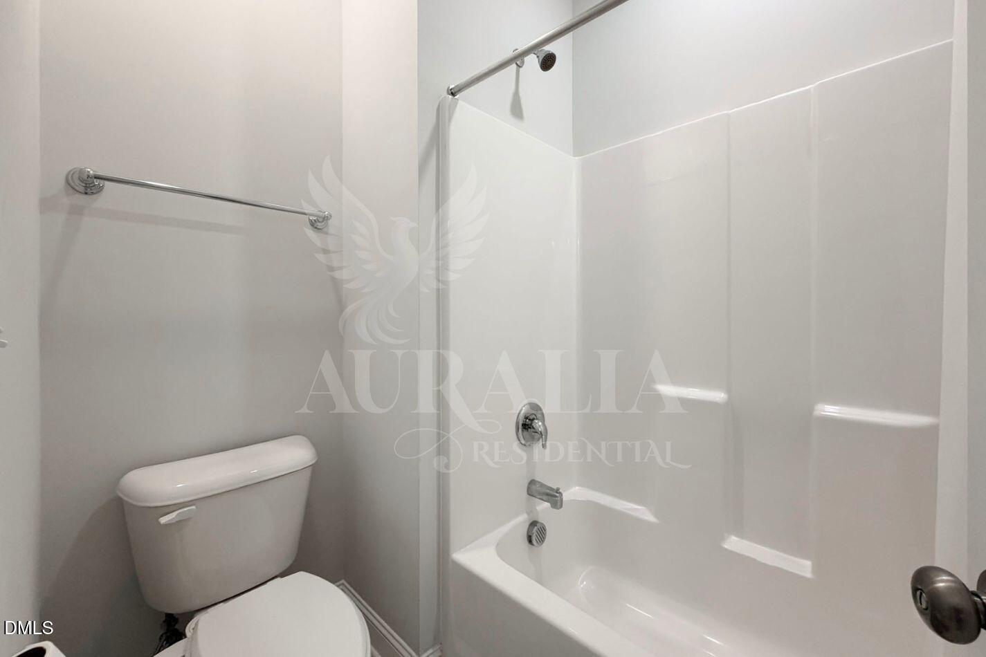 1306 Farm Pond Trail Durham, NC 27703 - Photo 23 of 46 a white toilet sitting next to a bath tub