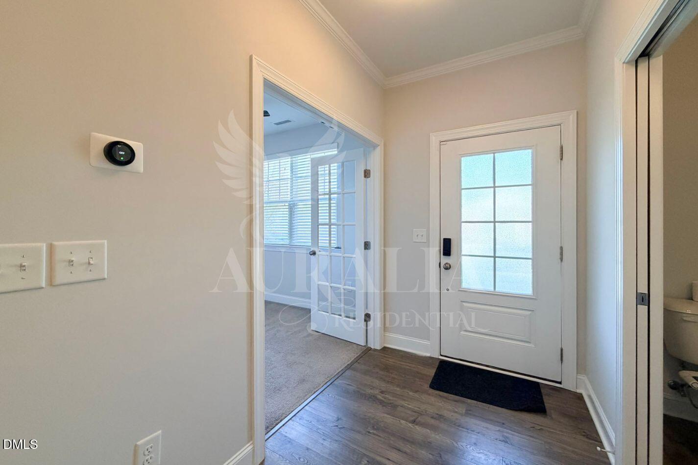 1306 Farm Pond Trail Durham, NC 27703 - Photo 3 of 46 an empty room with wooden floor and windows