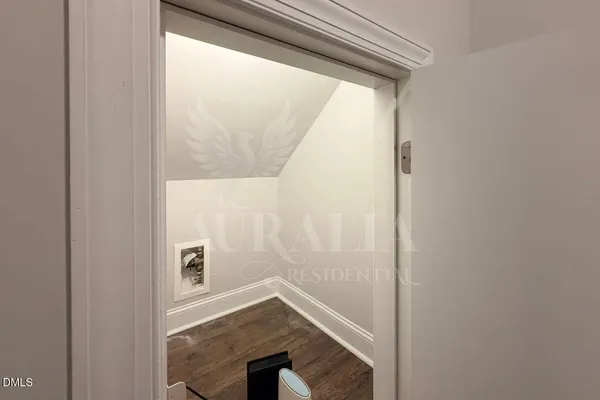 a view of empty room with white walls