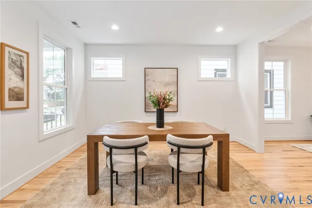 a living room with furniture window and wooden floor