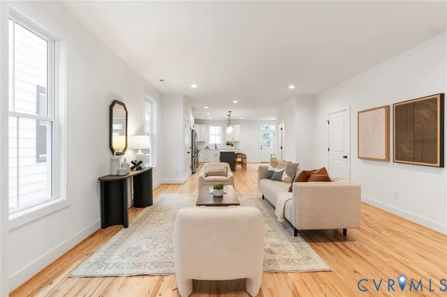a living room with furniture and a large window