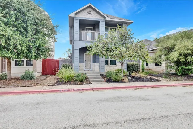 front view of a house with a street
