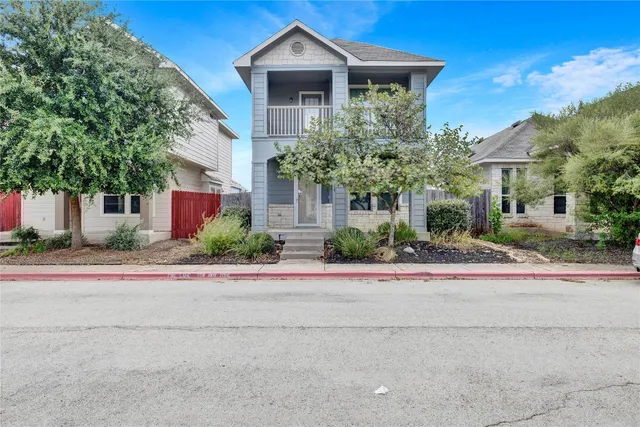 front view of a house with a small yard