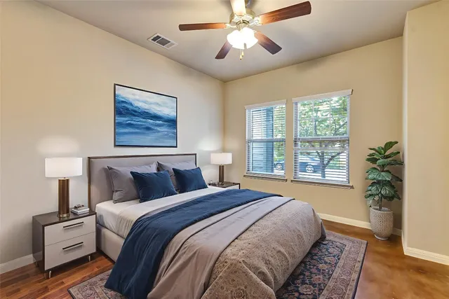 a bedroom with bed and window