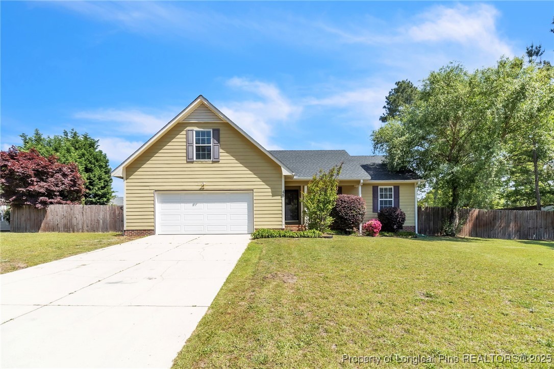 45 Ridgecrest Road Cameron, NC 28326 - Photo 1 of 32 a front view of a house with a yard and trees