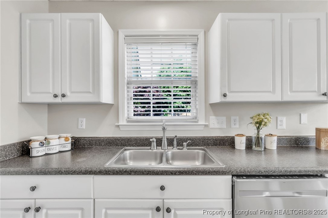 45 Ridgecrest Road Cameron, NC 28326 - Photo 13 of 32 a kitchen with granite countertop a sink window and cabinets