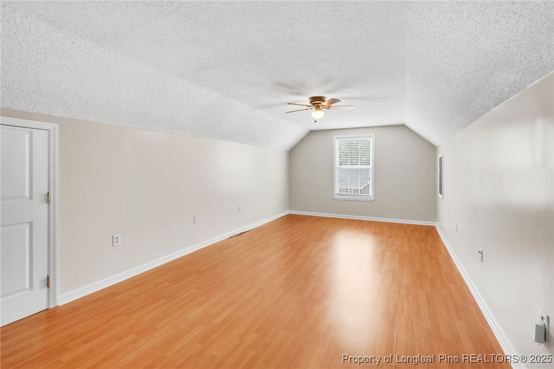 45 Ridgecrest Road Cameron, NC 28326 - Photo 26 of 32 an empty room with wooden floor and windows