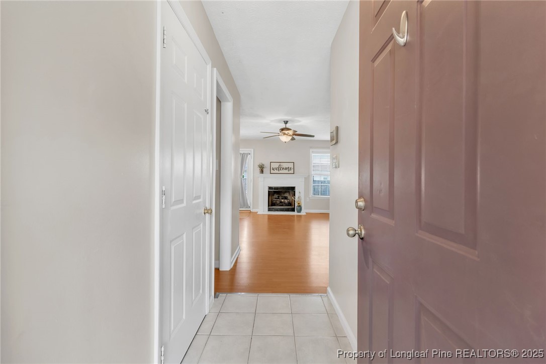 45 Ridgecrest Road Cameron, NC 28326 - Photo 5 of 32 a view of a hallway with wooden floor and a bathroom